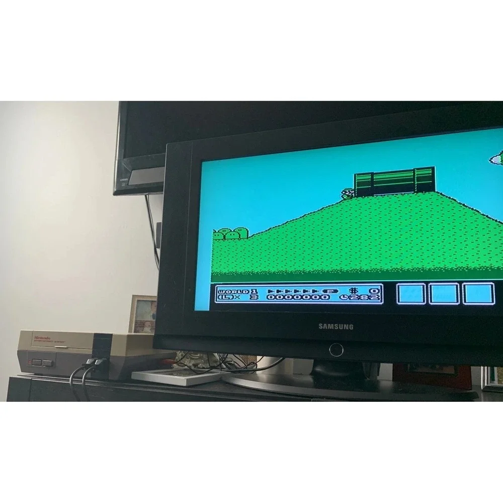 authentic NES Console Bundle with Super Mario Bros. 1,2,3 and 2 Controllers gun
